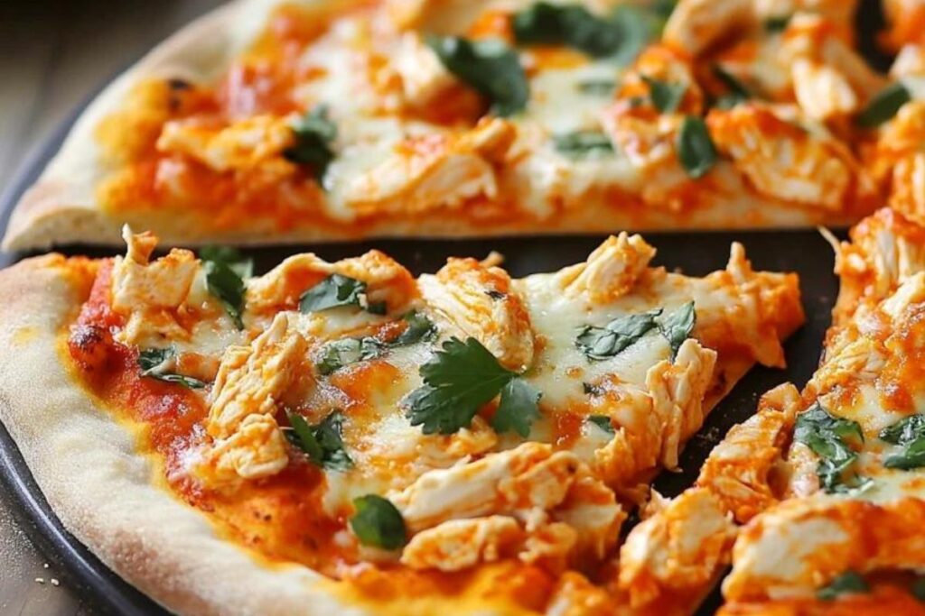 Buffalo Chicken Pizza topped with mozzarella, blue cheese, buffalo sauce, and red onions on a crispy crust.