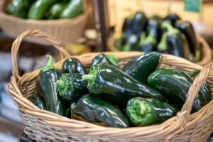 "Roasted poblano peppers with vibrant green skin, rich in vitamins and antioxidants"

